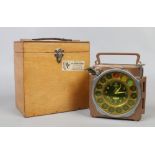 A vintage junior pigeon racing clock in wooden case.