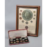 Framed coins of King George VI display along with a cased set of Great Britain's last issue with