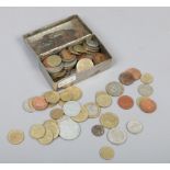 A collection of mostly foreign coins to include French examples.