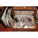 A vintage antler suitcase and contents of collectables including cut glass ships decanter, Martini