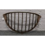 A cast iron hayfeeder width 89cm.