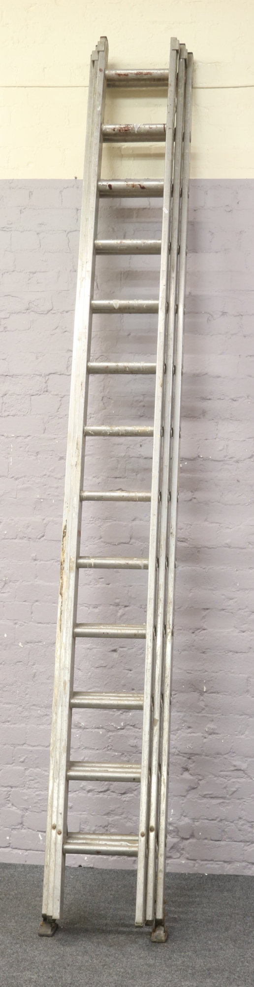 An aluminium triple 13 rung ladder by The British Ladder Manufactures Association.