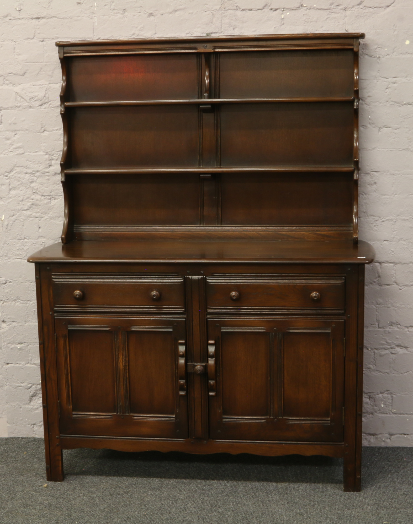 An Ercol panelled kitchen dresser.