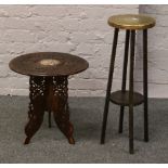 An Indian carved hardwood occasional table, along with a hardwood jardiniere stand with brass top.