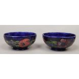 A matched pair of blue ground Moorcroft bowls in the anemone design artist signature and impressed