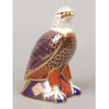 A Royal Crown Derby bone china paperweight formed as an eagle with gold stopper.Condition report