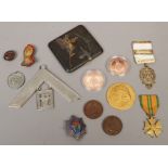 A Japanese komei cigarette case along with a collection of badges and medals including and