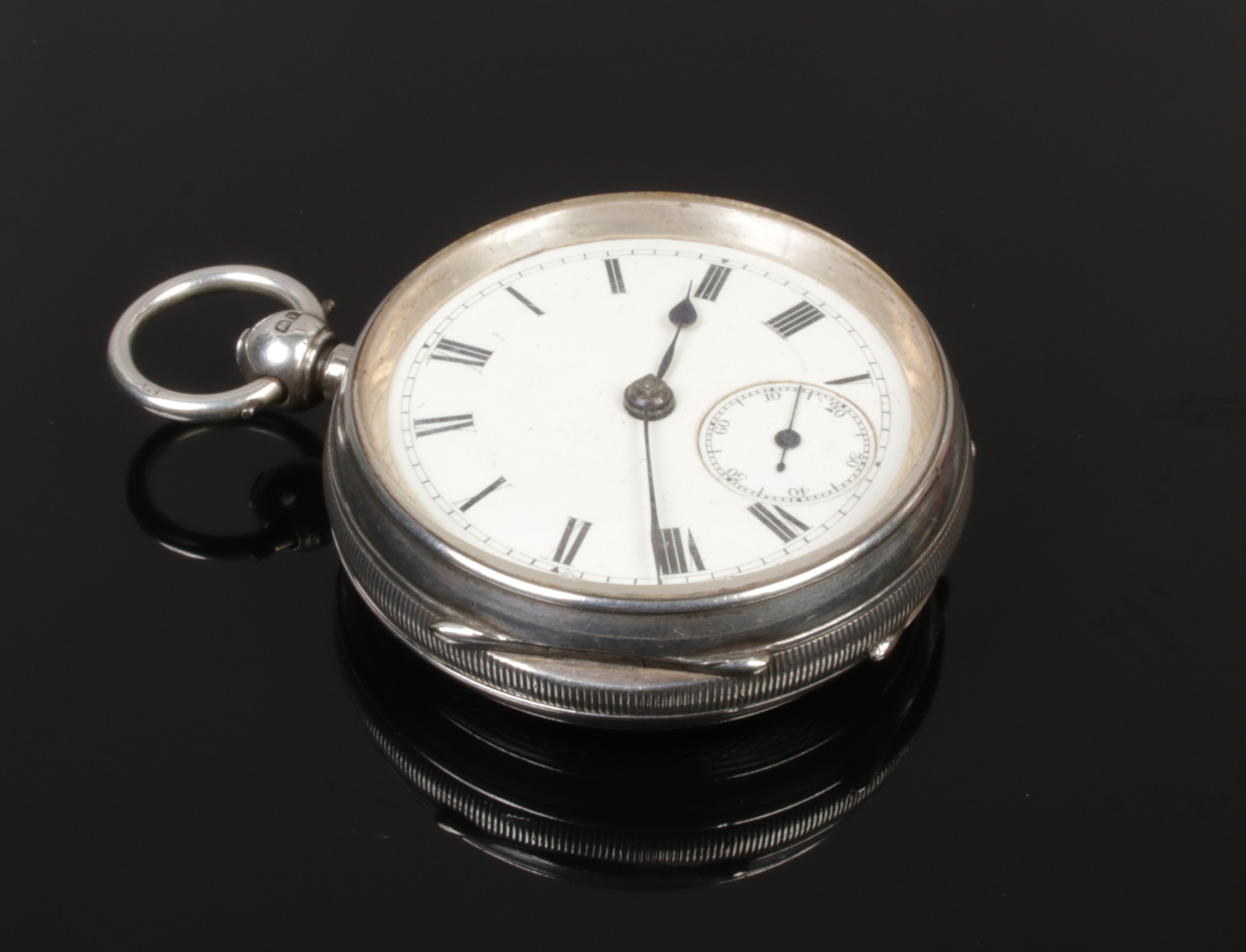 A silver pocket watch with Roman numeral markers and subsidiary dial, assayed Chester 1921.