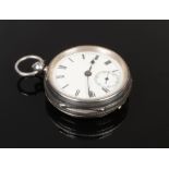 A silver pocket watch with Roman numeral markers and subsidiary dial, assayed Chester 1921.