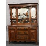 A Victorian carved mahogany mirror back sideboard with Art Nouveau handles.