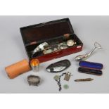 A lacquered glove box and contents of collectables to include yellow metal half hunter pocket watch,