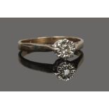 A gold and diamond illusion set solitaire ring, partial hallmarks, size O1/2.