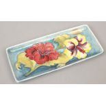 A rectangular turquoise ground Moorcroft pin dish in the hibiscus design with original makers