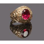 A 9ct gold Cambridge University ring set with a faceted red stone, size V.