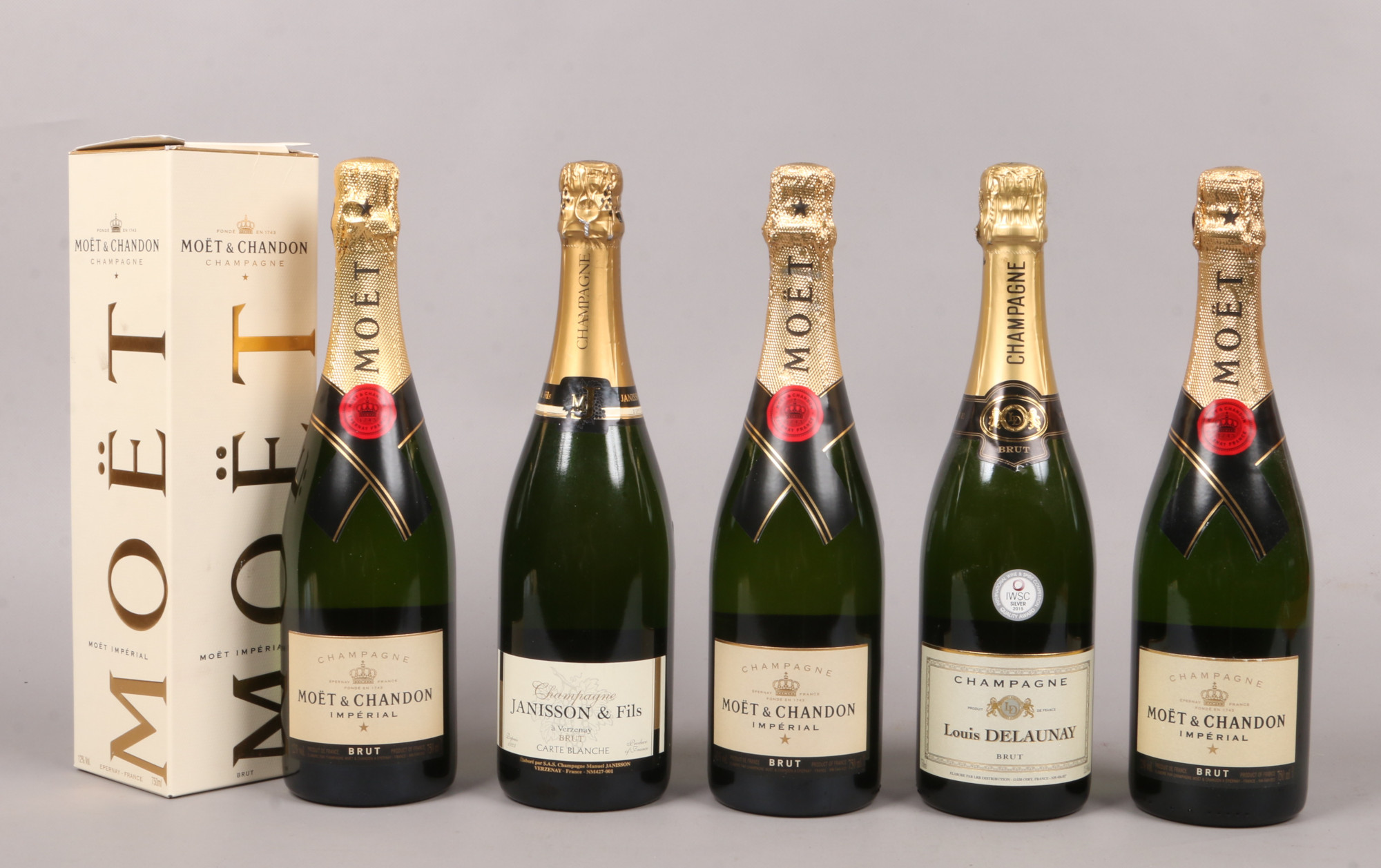 Five sealed 750ml bottles of Champagne; three Moet & Chandon Imperial Brut including a boxed