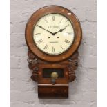 A carved drop dial wall clock with Roman numeral markers, signed A. Stinson Worksop. .