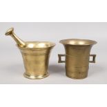 An 18th century bronze mortar and pestle and another antique mortar.