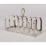 A silver seven bar toast rack assayed Birmingham 1961 by Henry Clifford Davis, 62 grams.