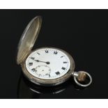 A silver full hunter pocket watch with Roman numeral markers.