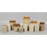 A collection of stoneware storage jars to include preserve examples.