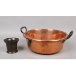 A twin handle copper and iron cooking pot 37.5cm diameter, along with an antique bronze mortar.