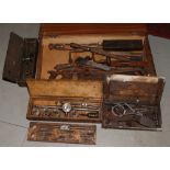 A collection of vintage tools to include wooden cased tap and die set, saws, files, pliers etc.