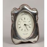 A silver mounted quartz Clock Master mantle clock, assayed Sheffield 1994 by Carr's of Sheffield