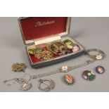 A box of costume jewellery to include silver Celtic brooch, ladies quartz and manual wristwatches,