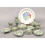 A Poole plate and a collection of green Wedgwood Jasperware to include vases, trinket dishes / boxes