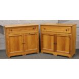 A pair of pine side cabinets.