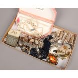 A box of costume jewellery to include simulated pearls, bracelets, brooches, cufflinks etc.