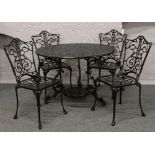 A black painted aluminium patio set, circular table with four matching chairs.