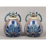 A pair of Bursley ware twin handle vases in the Bagdad decoration.