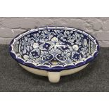 A blue and white pottery sink bowl with floral decoration, length 54cm, width 43cm, depth 19cm.