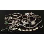 A box of silver and white metal jewellery including bangles, necklaces, pendants, earrings etc.