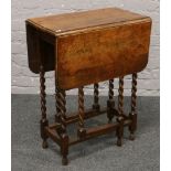 An oak barley twist drop leaf table