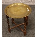 A barleytwist brass top folding occasional table.