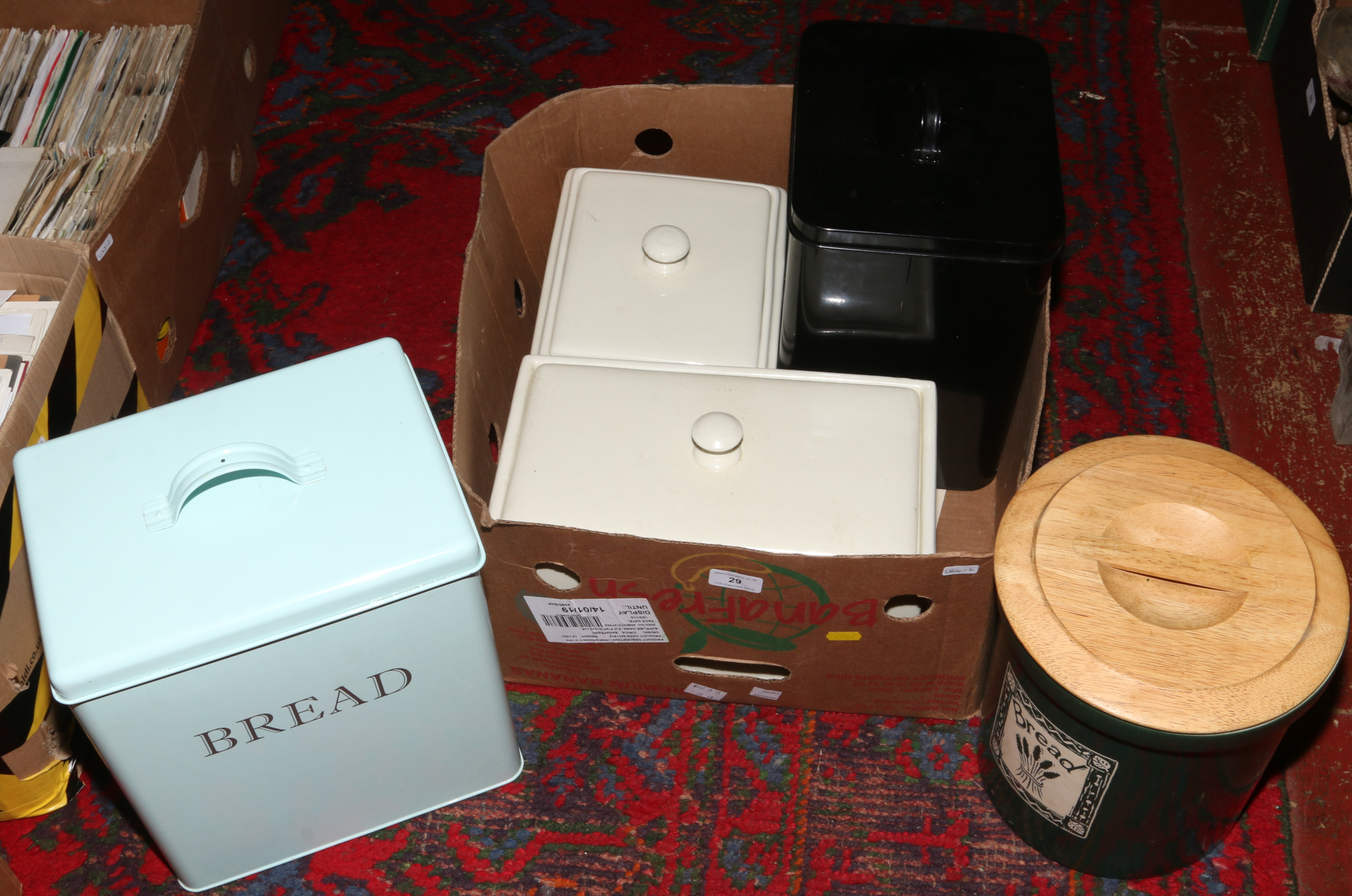 A box of five bread bins to include enamel examples etc.