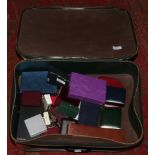 A suitcase of costume jewellery to include simulated pearls, earrings, brooches, necklaces, some
