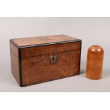 A 19th century bur walnut tea caddy with brass mounts along with a treen storage vessel.