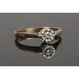 A gold and diamond illusion set solitaire ring, partial hallmarks, size O1/2.