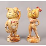 Two ESSO advertising cast iron money boxes marked Herr Tropf and Frau Tropf, standing 23.5cm tall.