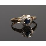 A 9ct gold sapphire and diamond daisy cluster ring, size K.