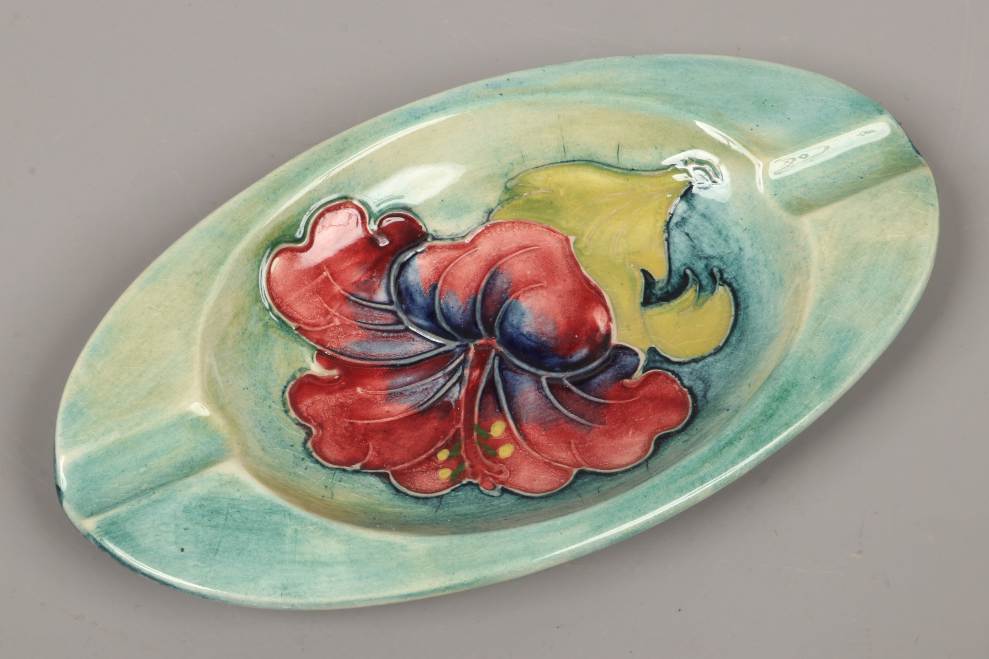 A Moorcroft oval dish in the Hibiscus design.