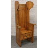 A solid pine lambing chair with single drawer.