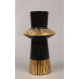 A Crown Devon vase in the Memphis design with black ground and gilt decoration by Colin Melbourne,