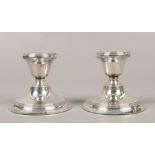 A pair of silver candlesticks, assayed Birmingham 1919 Henry Clifford Davis.