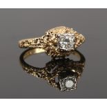 An 18ct gold diamond solitaire ring with textured abstract setting, gross weight 4.68 grams, size