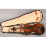 A cased vintage violin in need of restoration. (Back Length 35.5cm)