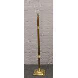 A brass reeded column standard lamp.